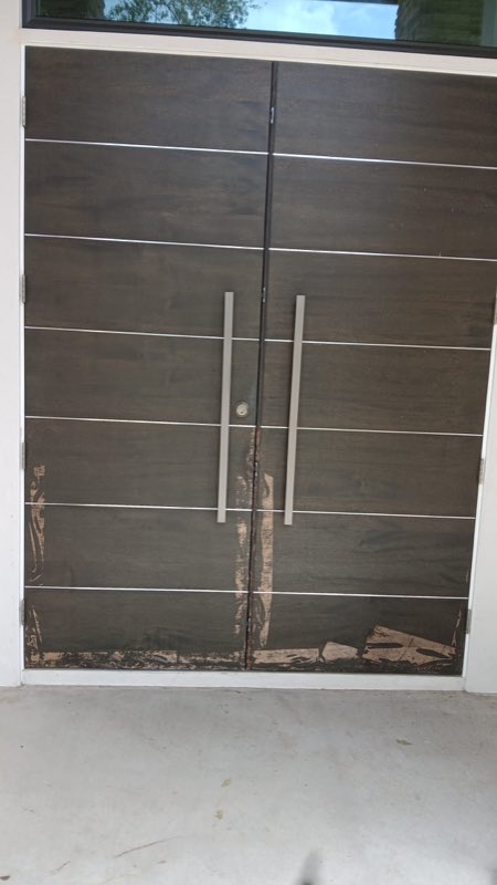 Modern double entry doors before staining