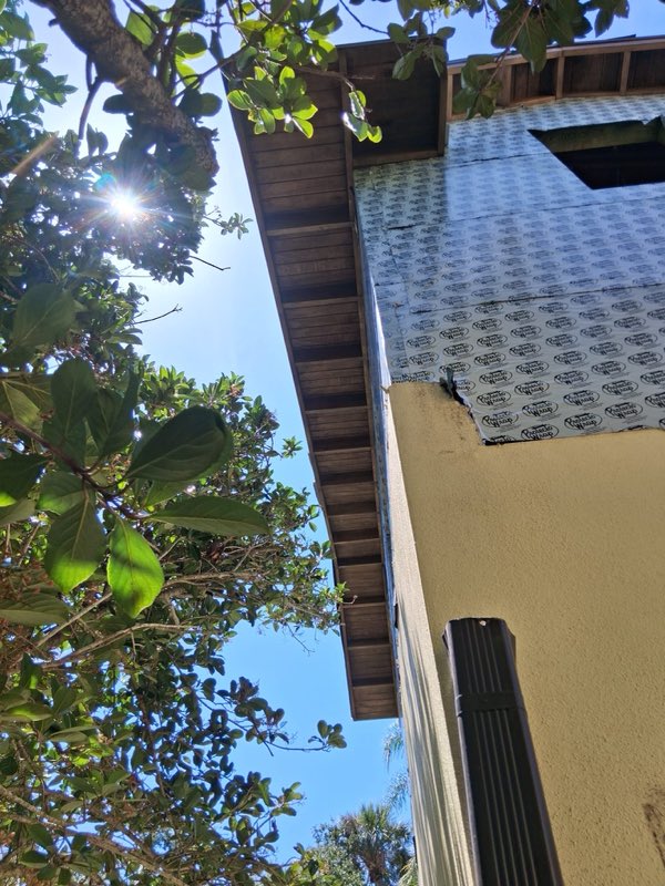 Soffit and fascia protected before spraying